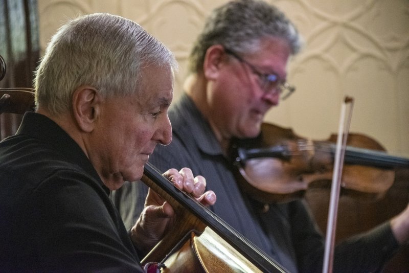Shrewsbury String Quartet members Anthony Gizzi on cello, left, and second violinist Frederick Geiersbach perform a sonata.